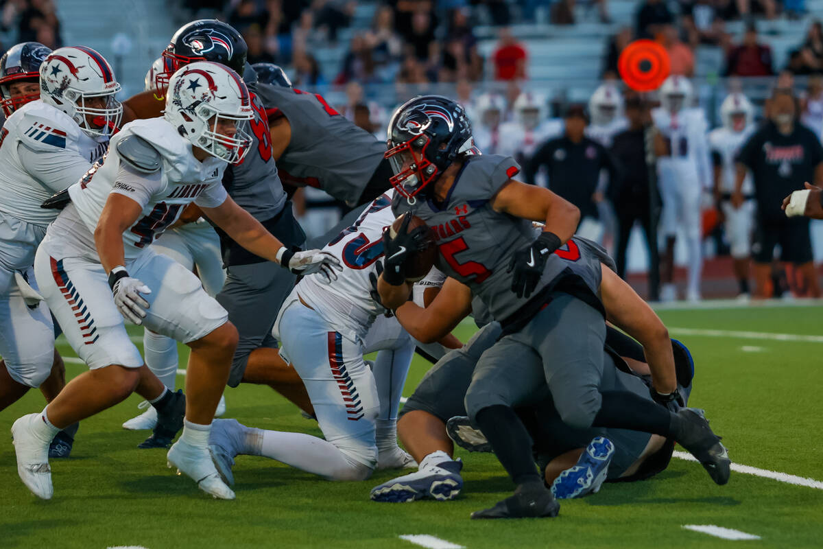 Coronado Running Back Derek Hurley (5) runs the ball during a football game between Liberty and ...