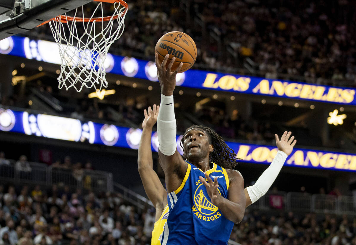 Golden State Warriors forward Kevon Looney (5) attempts a layup during the NBA preseason basket ...