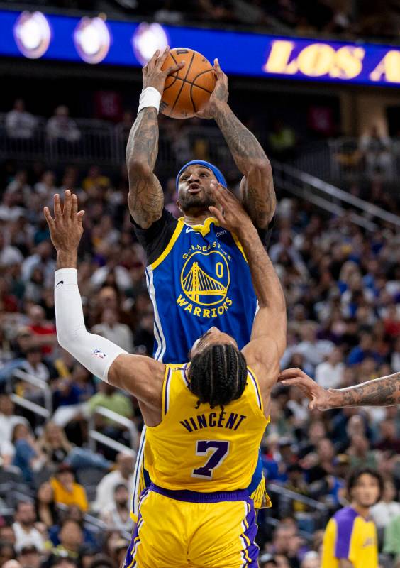 Golden State Warriors guard Gary Payton II (0) shoots the ball over Los Angeles Lakers guard Ga ...