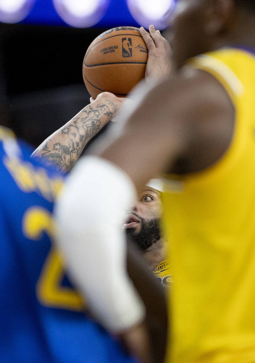 Los Angeles Lakers forward Anthony Davis (3) shoots a free throw during the NBA preseason baske ...