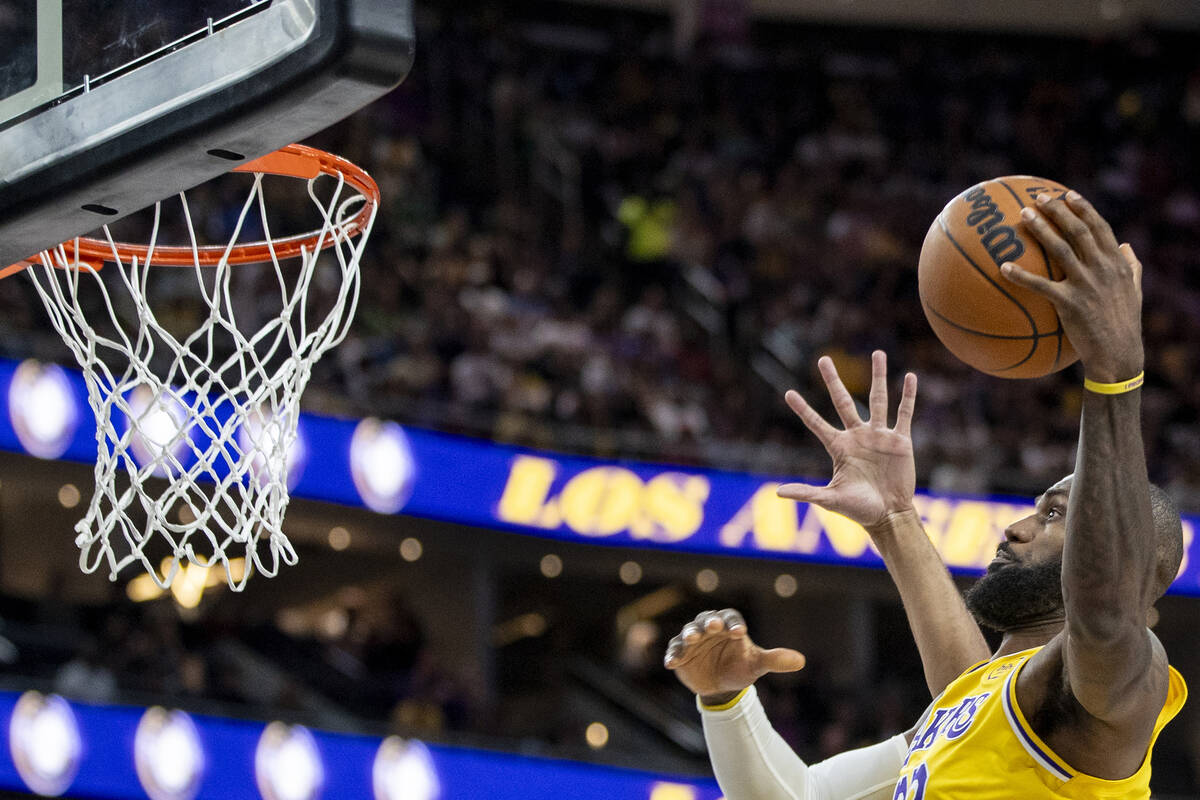 Los Angeles Lakers forward LeBron James (23) attempts to dunk the ball during the NBA preseason ...