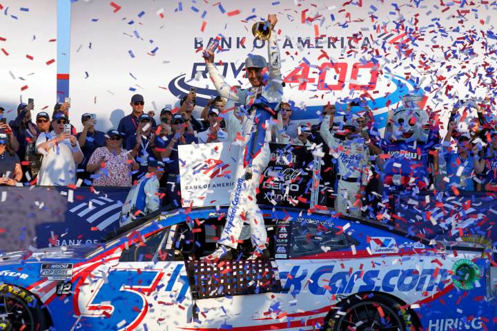 Kyle Larson, center, celebrates in Victory Lane after winning a NASCAR Cup Series auto race at ...