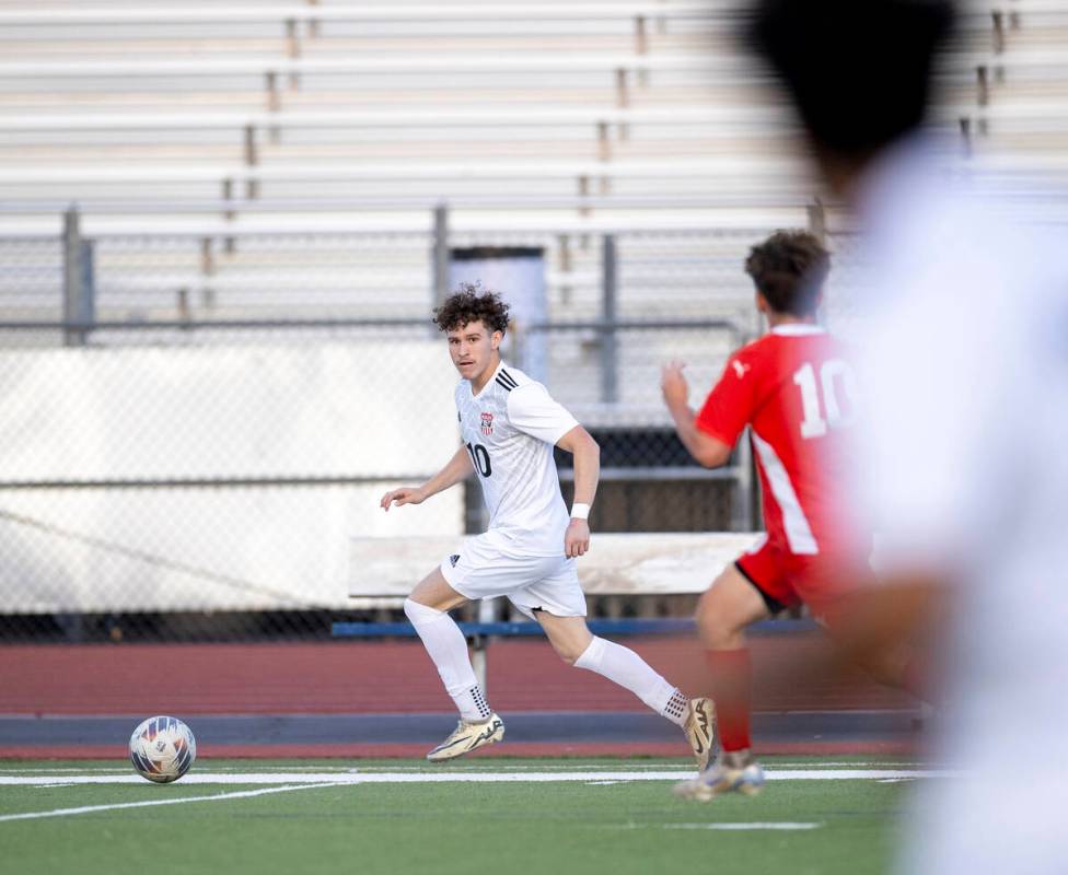 Las Vegas High senior Daniel Murillo (10) runs with the ball during the high school soccer game ...