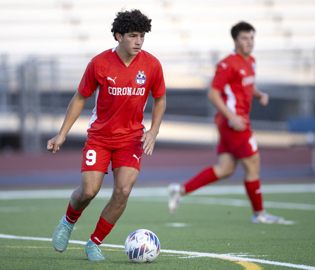 Coronado junior Dylan Flores (9) controls the ball during the high school soccer game against L ...