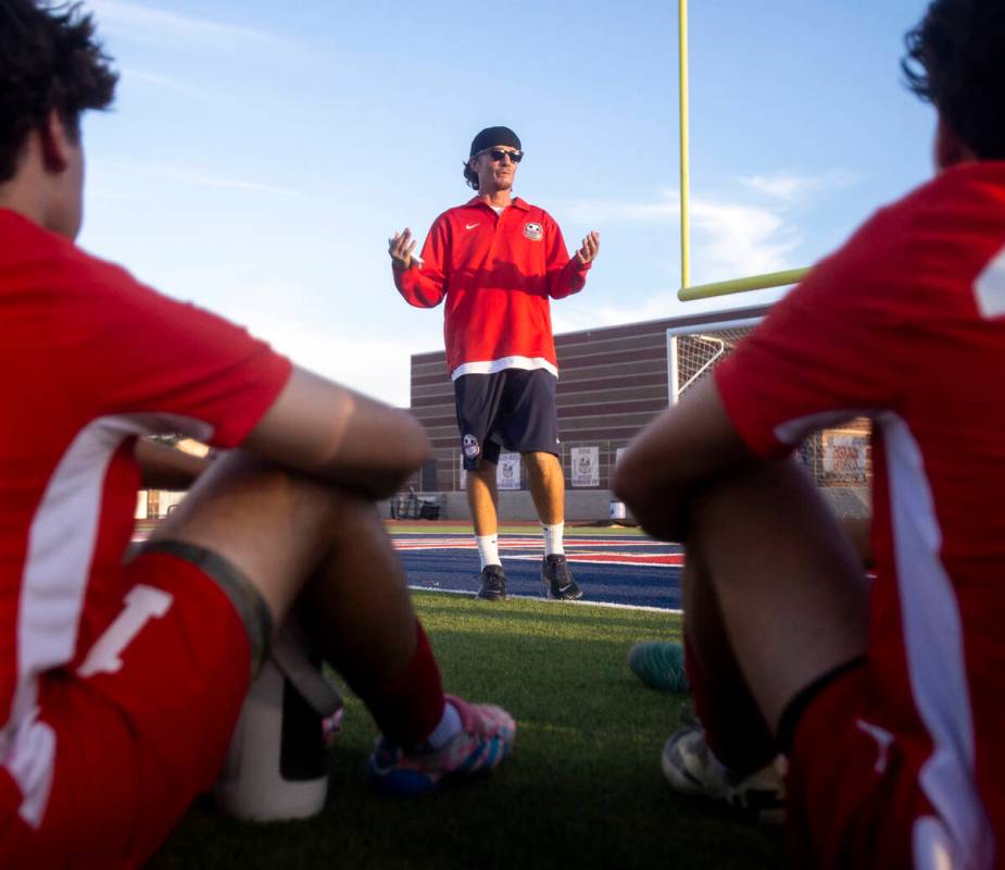 Coronado Head Coach Dustin Barton talks to his players at halftime during the high school socce ...