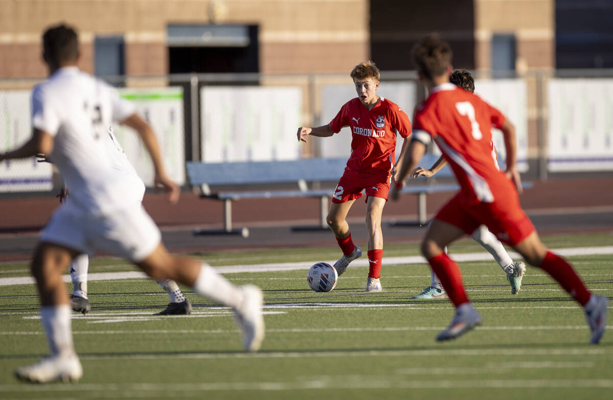 Coronado midfielder Liam Bringhurst (12) looks to pass the ball during the high school soccer g ...