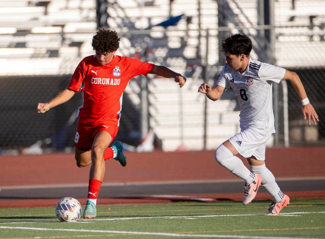 Coronado junior Dylan Flores (9) keeps the ball from Las Vegas High midfielder Oscar Sandoval ( ...