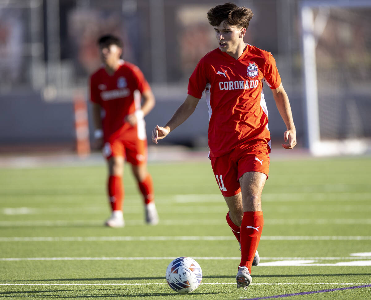 Coronado junior Gavin Flickinger (11) controls the ball during the high school soccer game agai ...