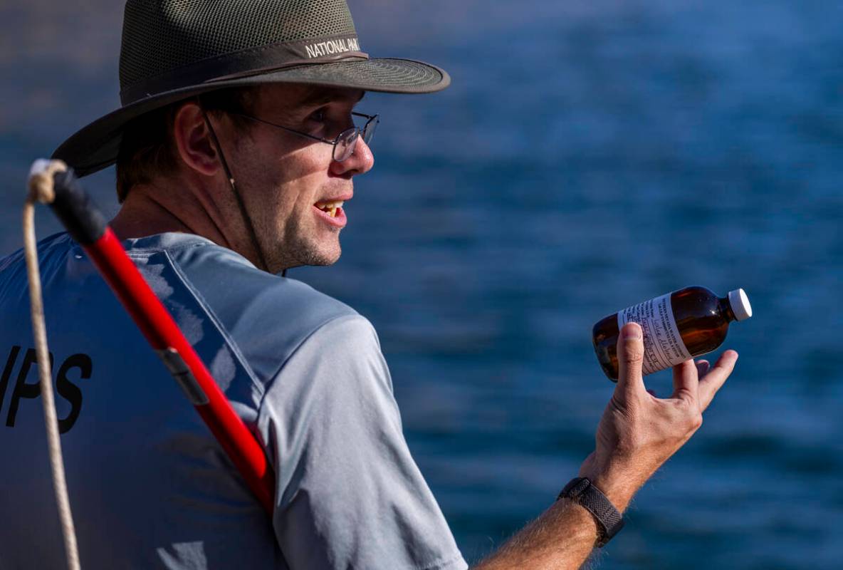 Aquatic Ecologist Riley Rackliffe with the National Park Service holds another water sample whi ...