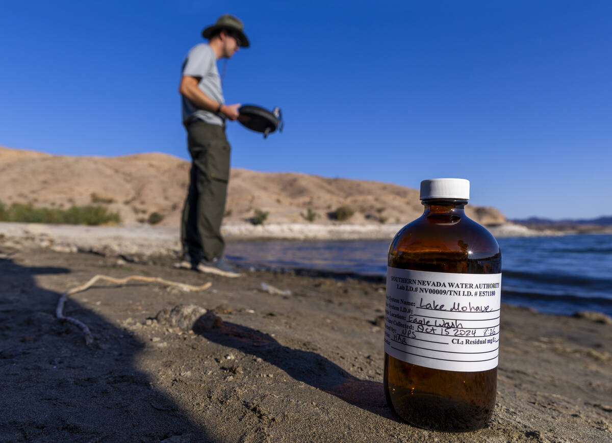 A sample bottle is ready to be filled as Aquatic Ecologist Riley Rackliffe with the National Pa ...