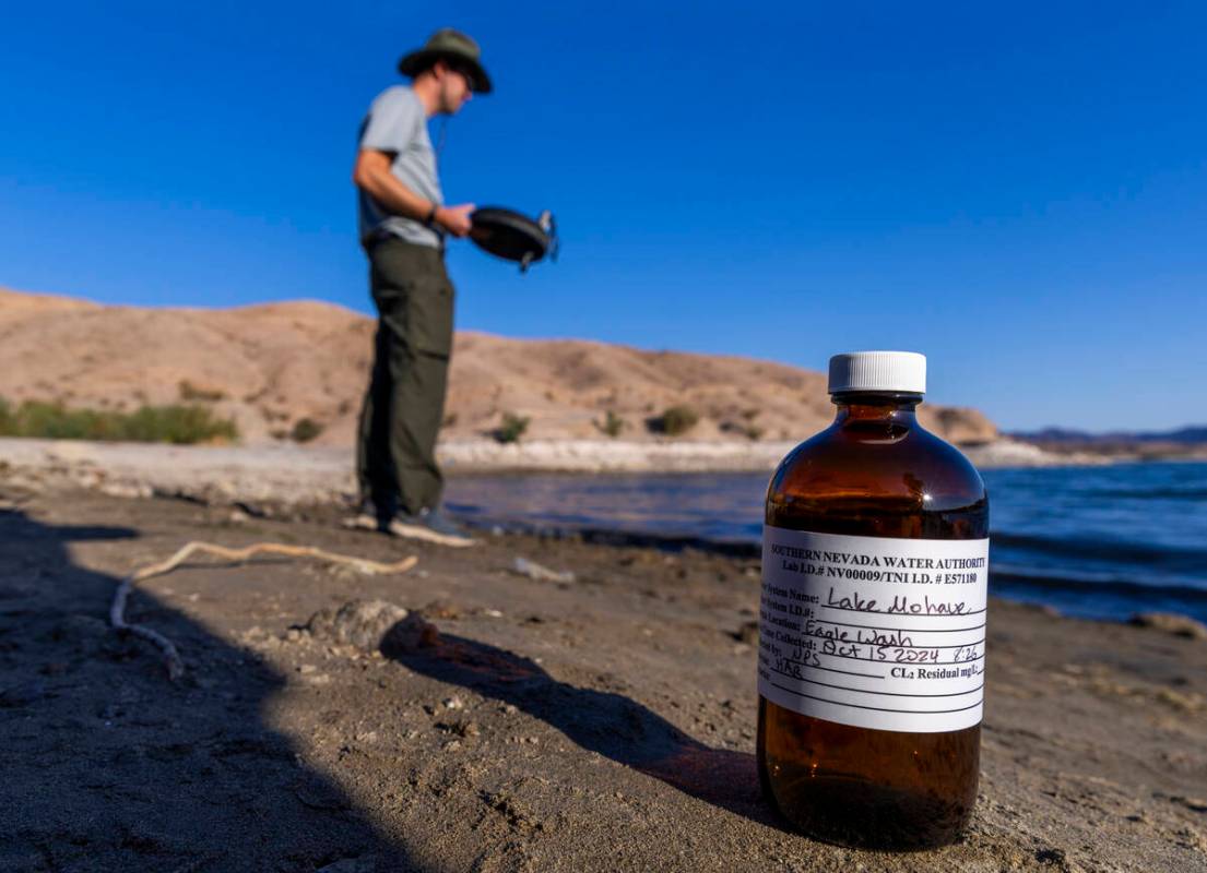 A sample bottle is ready to be filled as Aquatic Ecologist Riley Rackliffe with the National Pa ...