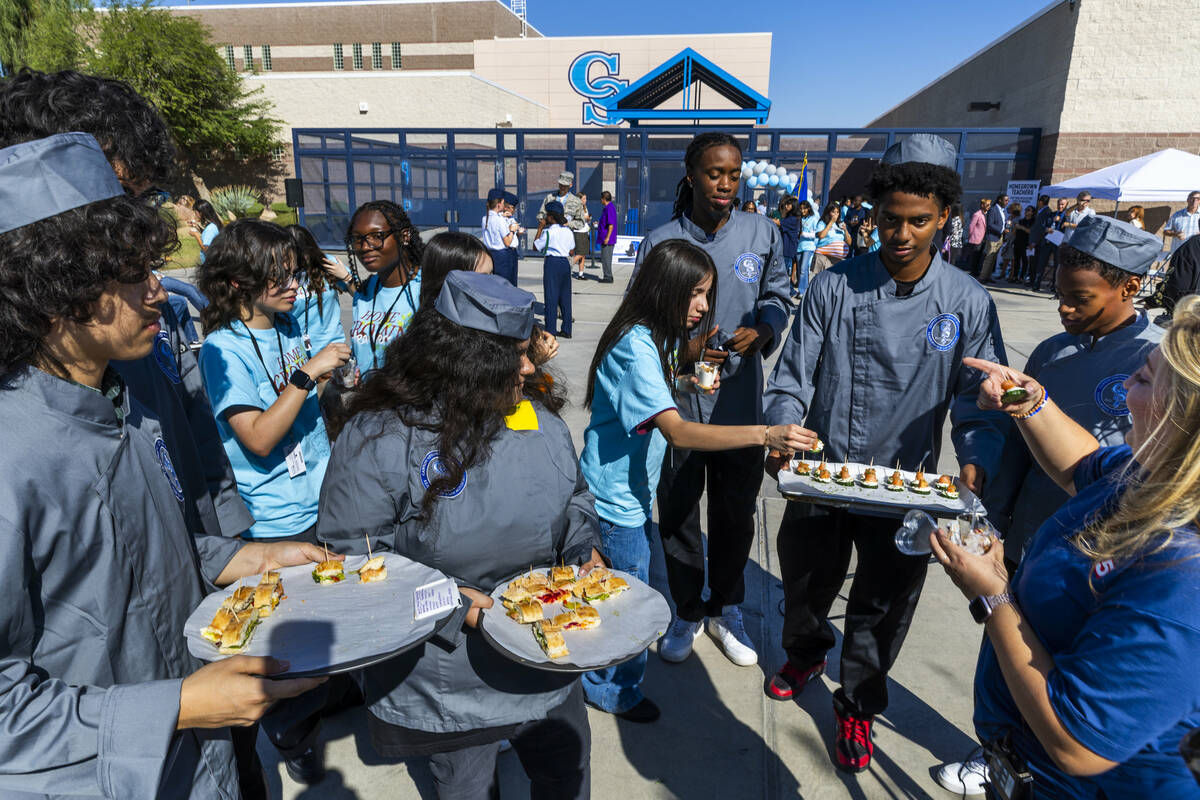 Culinary students serve some of their creations after the Silver State Education Foundation's o ...