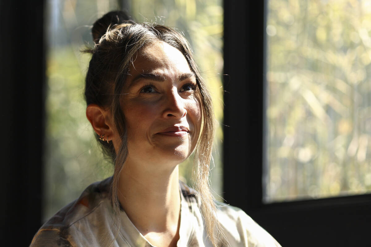 Headspace meditation teacher, Rosie Acosta, looks on in her sun room Monday, Sept. 30, 2024, in ...