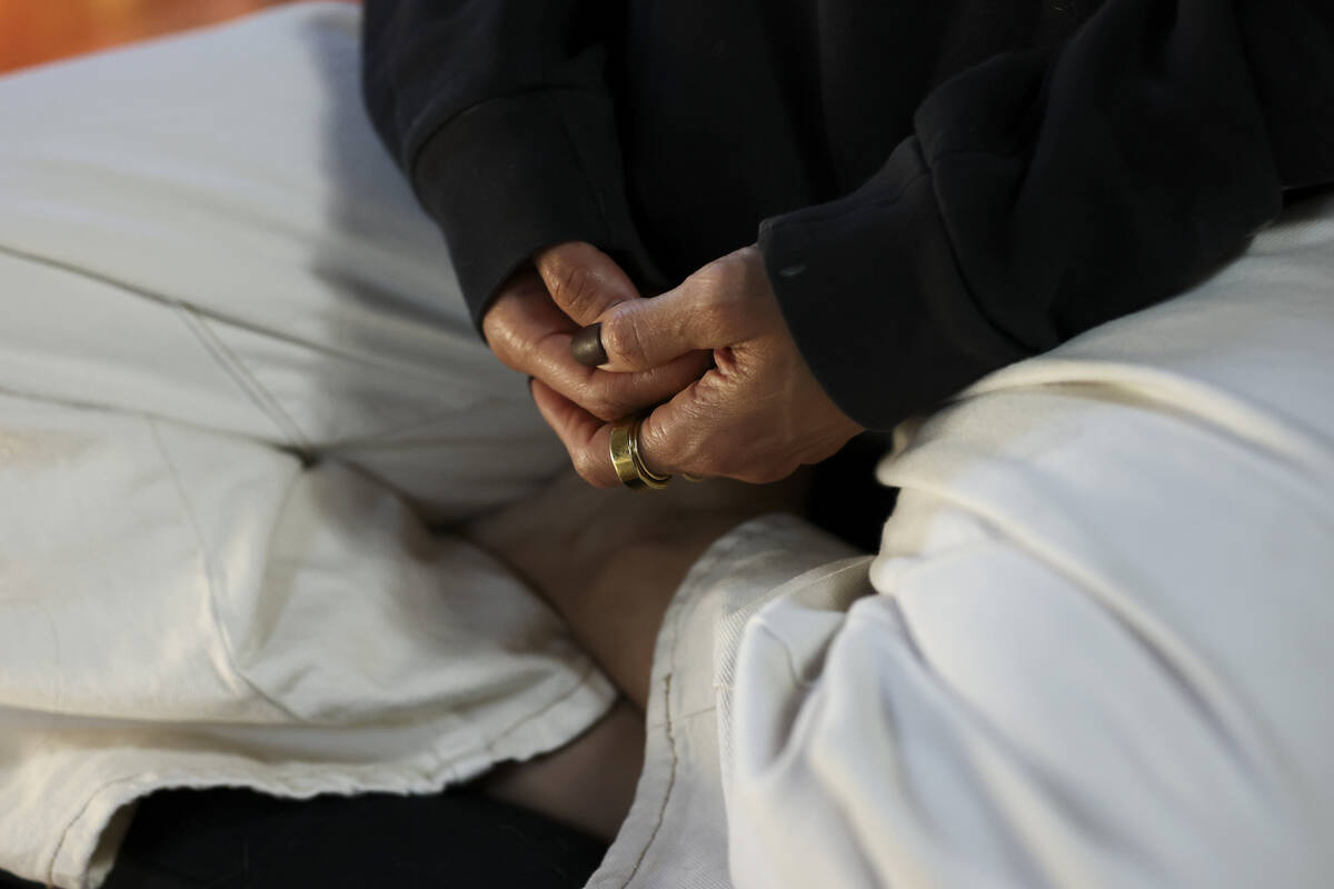 A detail view of the hands of Headspace meditation teacher, Rosie Acosta, is seen as she medita ...