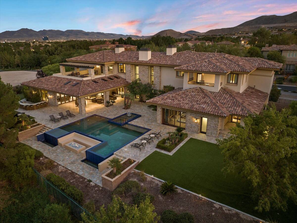 The 12,707-square-foot Southern Highlands house has five bedrooms, eight bathrooms and a five-c ...