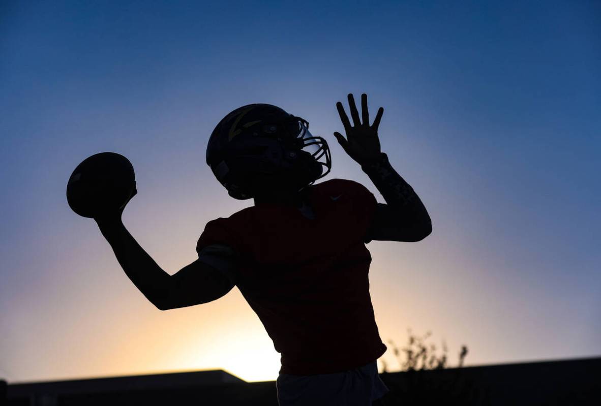 Quarterback Alexander Mercurius throws the ball during football practice at Durango High School ...