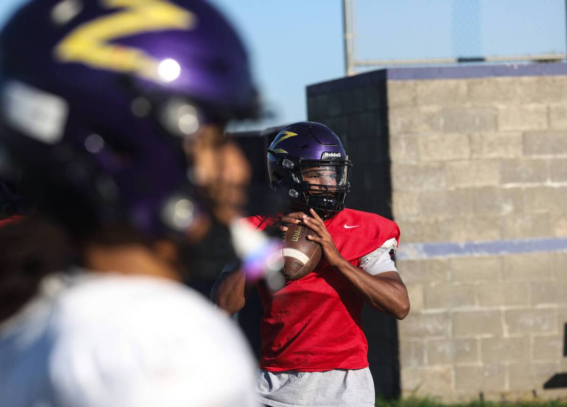 Quarterback Alexander Mercurius winds up to throw the ball during football practice at Durango ...