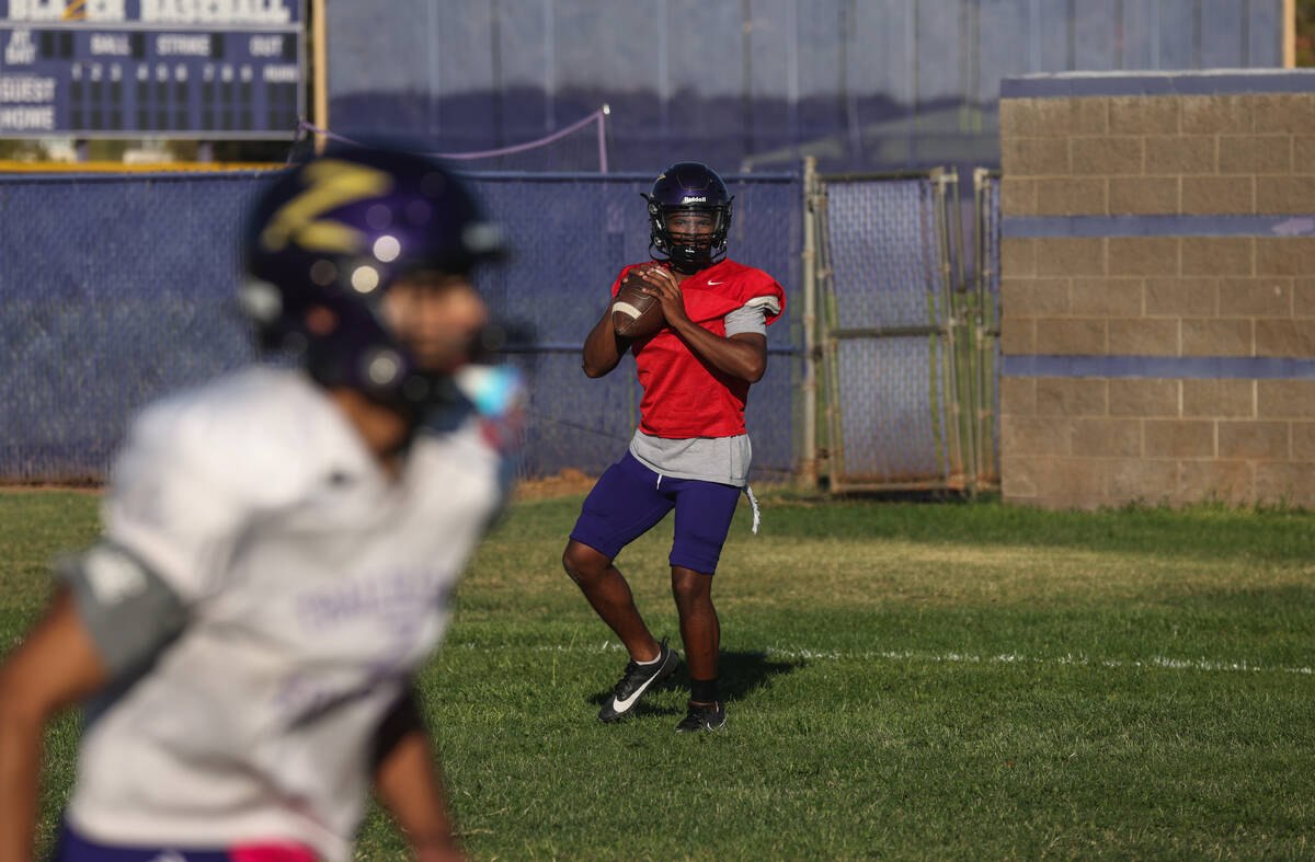 Quarterback Alexander Mercurius prepares to throw the ball during football practice at Durango ...