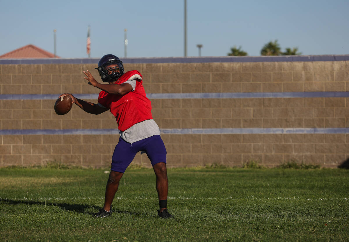 Quarterback Alexander Mercurius winds up to throw the ball during football practice at Durango ...