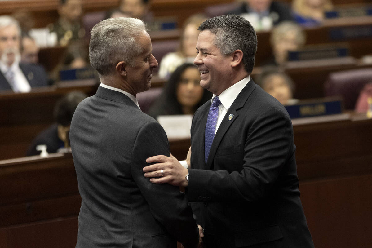 Assemblymen Toby Yurek, R-Henderson, left, and Steve Yeager, D-Las Vegas, greet each other as t ...