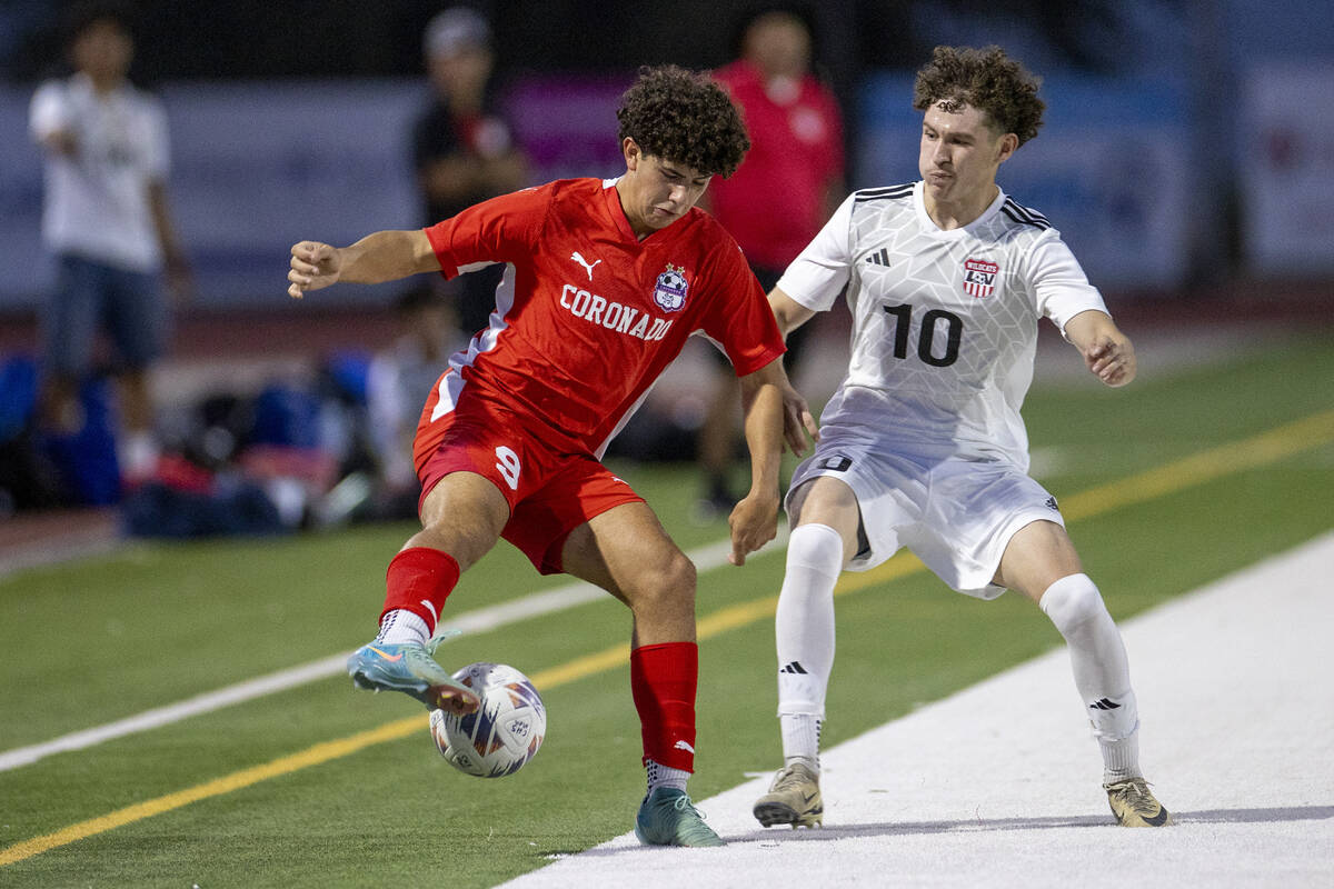 Coronado junior Dylan Flores (9) and Las Vegas High senior Daniel Murillo (10) compete for the ...