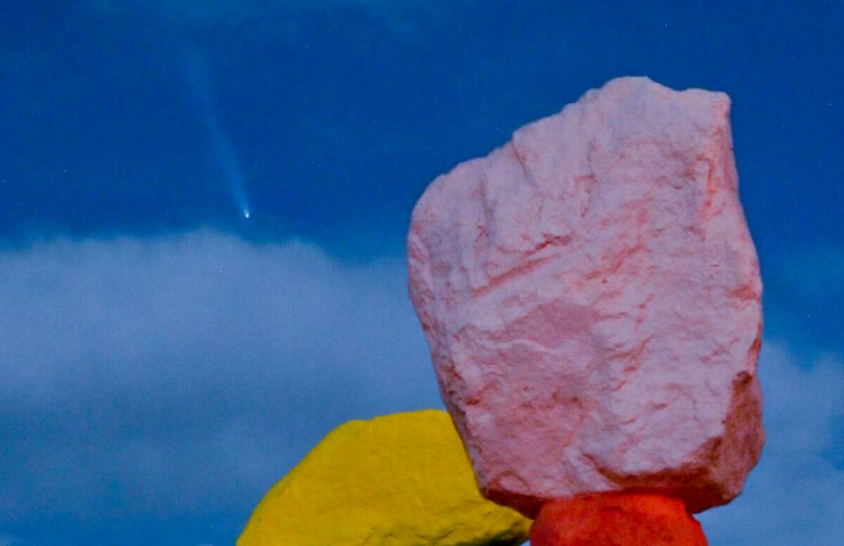 "Seven Magic Mountains," by artist Ugo Rondinone, is illuminated by a supermoon as Comet Tsuchi ...