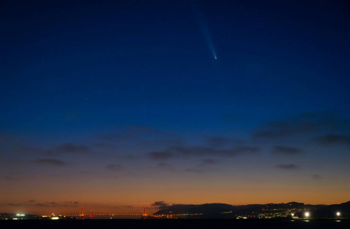 Comet Tsuchinshan-Atlas is seen above the Golden Gate Bridge during sunset as seen from the Ber ...