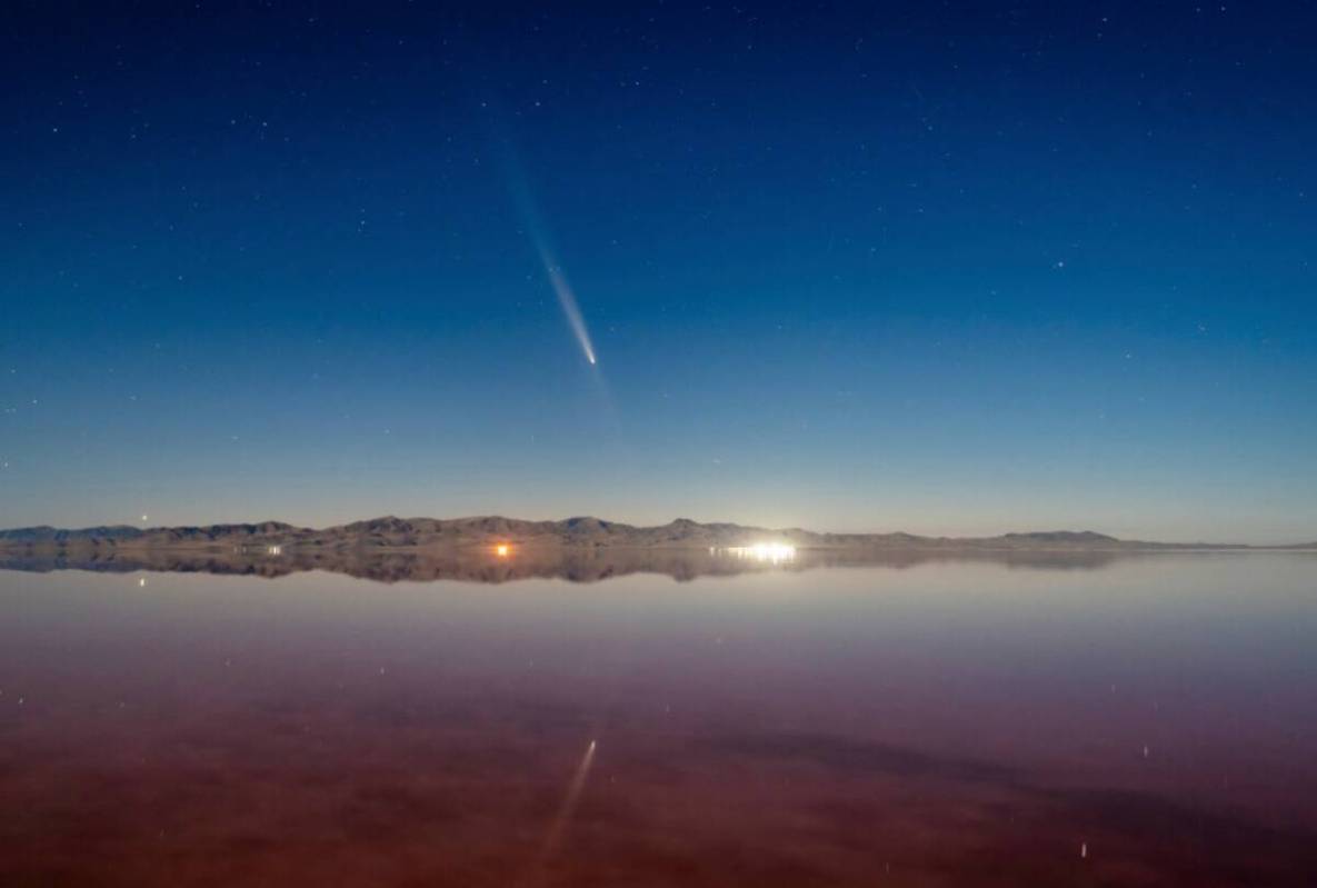 Comet Tsuchinshan-Atlas is visible in the sky over the Great Salt Lake west of Salt Lake City, ...