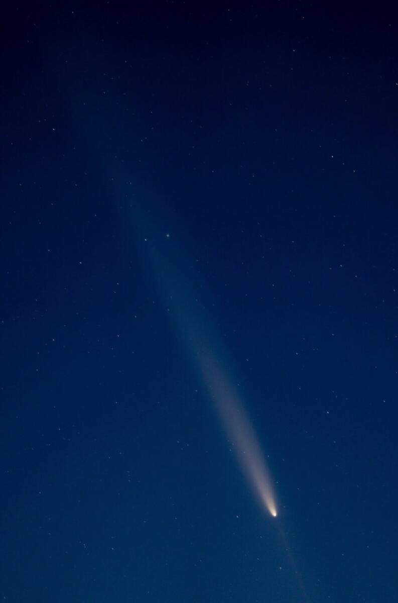 Comet Tsuchinshan-Atlas is visible in the sky over the Great Salt Lake west of Salt Lake City, ...