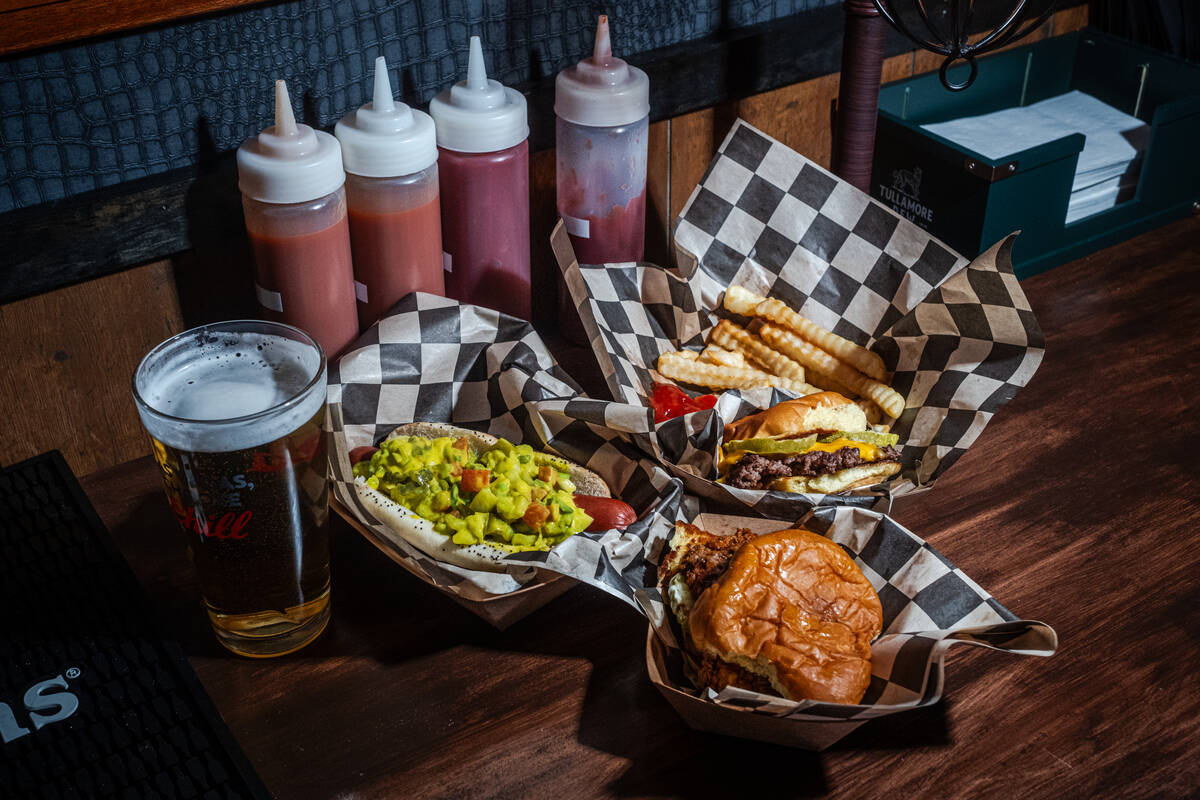 Dishes from Jive Turkey bar in downtown Las Vegas, clockwise from bottom: a chicken sandwich, a ...