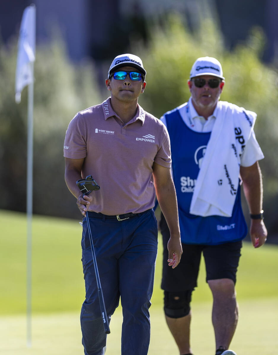 Kurt Kitayama walks away unhappy with his caddie at hole #7 during the opening round of the Shr ...