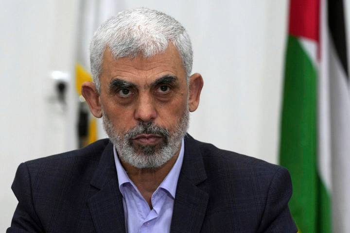 FILE - Yahya Sinwar, head of Hamas in Gaza, chairs a meeting with leaders of Palestinian factio ...