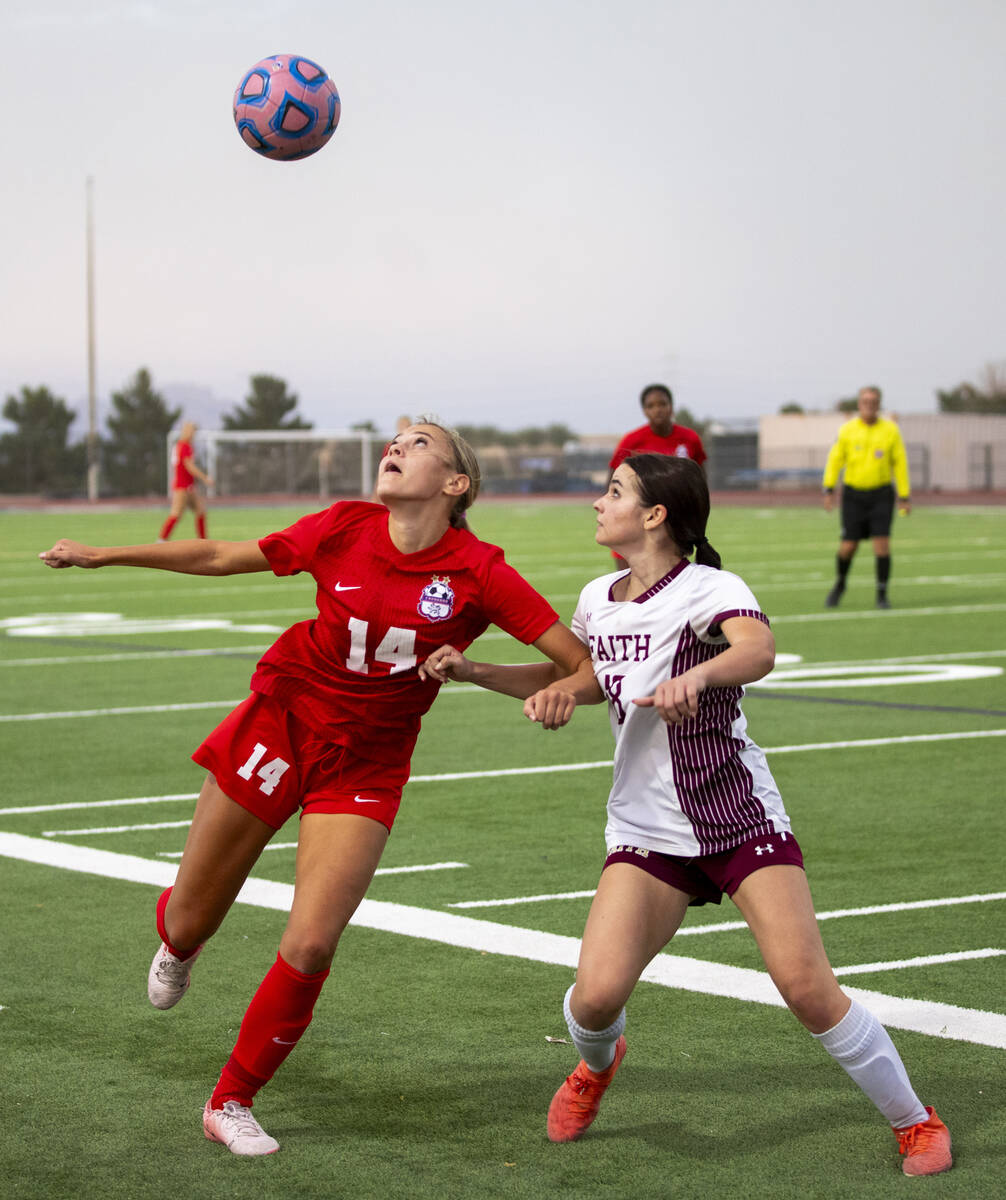 Coronado midfielder Allison Kleiner (14) and Faith Lutheran defender Addison Jarvis (18) compet ...