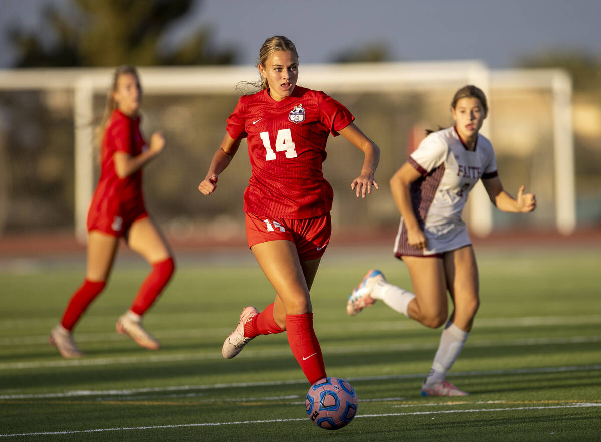 Coronado midfielder Allison Kleiner (14) moves the ball down the field during the high school s ...