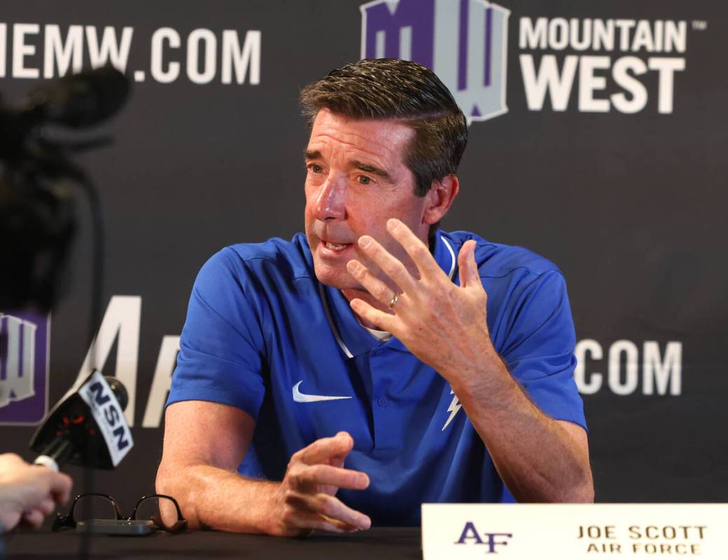 Joe Scott, head coach at Air Force, speaks during the Mountain West Conference men's basketball ...