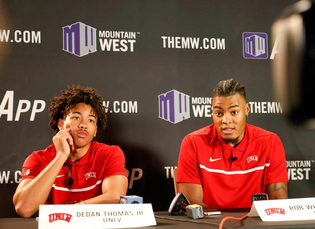 UNLV Rebels forward Rob Whaley Jr. speaks as guard Dedan Thomas Jr., left, looks on during the ...