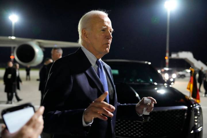 President Joe Biden gestures as he speaks after arriving at Brandenburg Airport in Schoenefeld ...