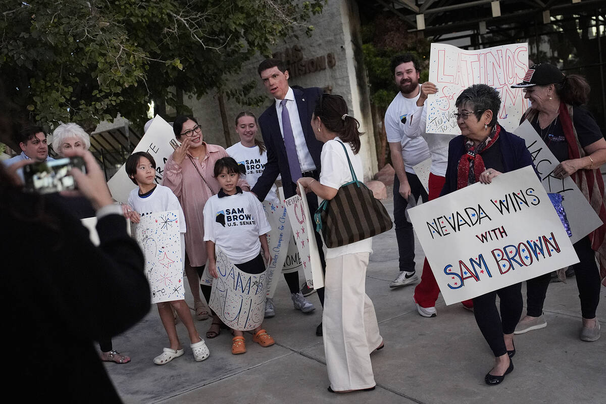 Republican Senate candidate Sam Brown, center, meets with supporters before a debate against Se ...