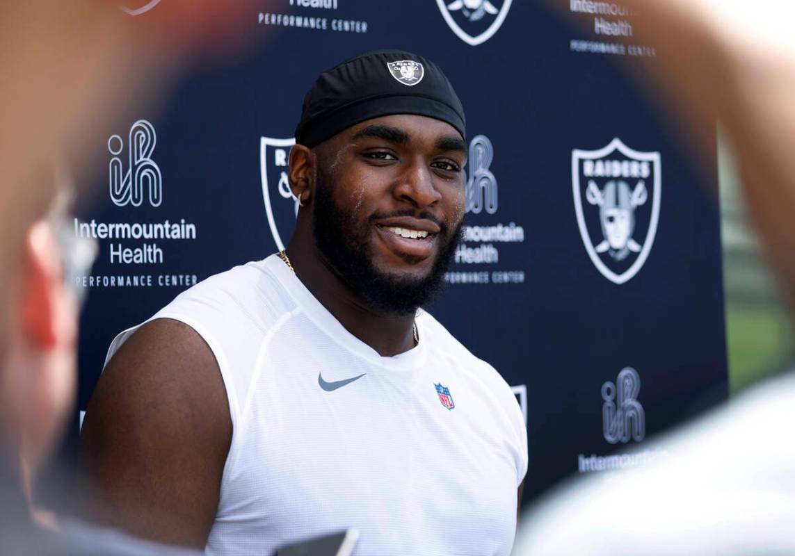 Raiders rookie defensive tackle DJ Glaze listens to reporters questions as he addresses the med ...