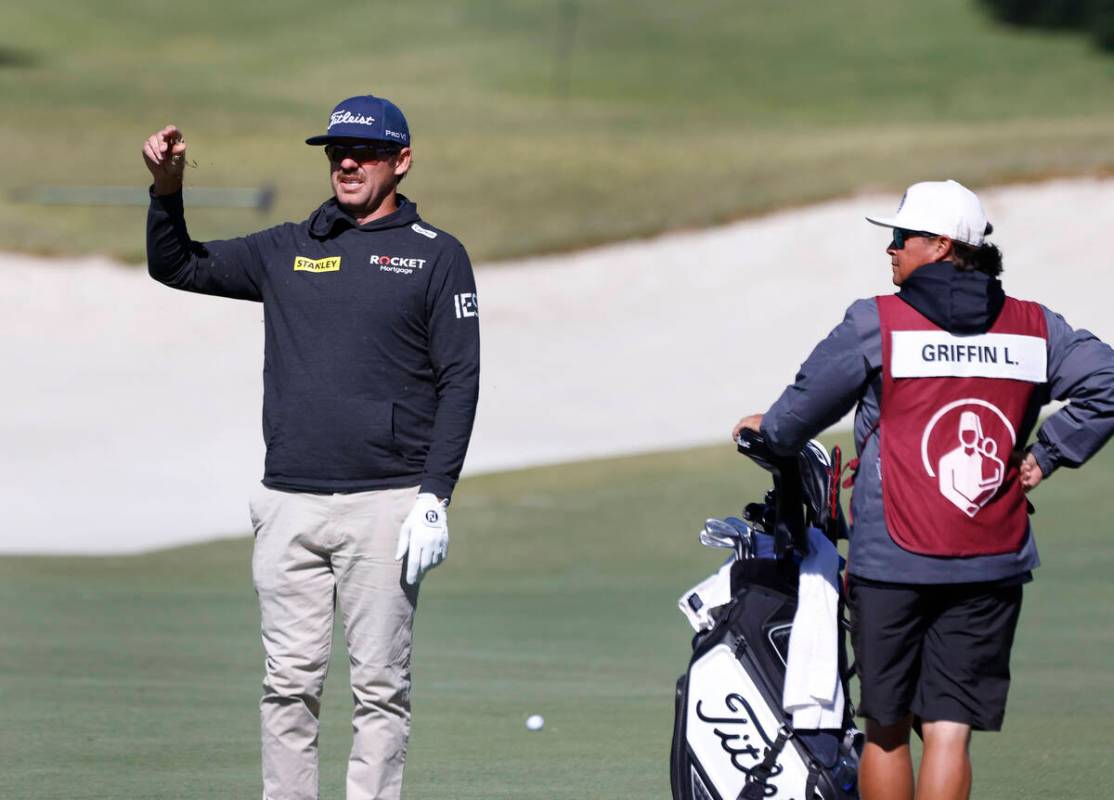 Lanto Griffin sprinkles grasses to determine the direction of the wind as he prepares to hit fr ...