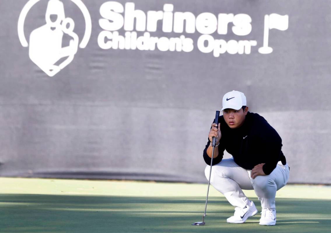 Tom Kim checks the line at hole #9 during the second round of the Shriners Children's Open at T ...