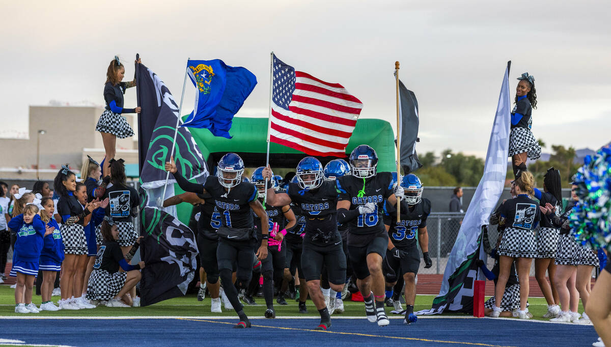 Green Valley players take the field to face Faith Lutheran for the first half of their NIAA foo ...