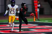 Las Vegas wide receiver Mychael Walker (6) carries the ball into the end zone for a touchdown d ...