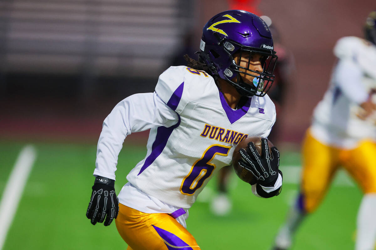 Durango wide receiver Amil Donald (6) runs the ball during a high school football game between ...