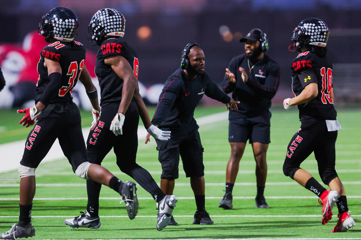 Las Vegas players run to the sidelines during a high school football game between Durango and L ...