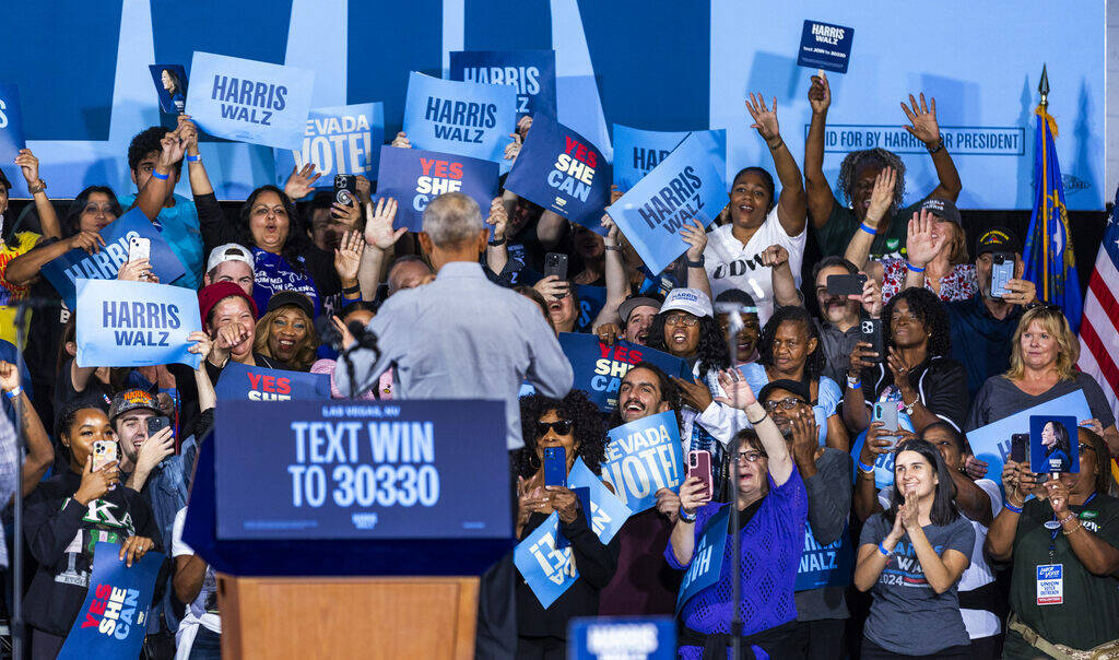 Former President Barack Obama greets the crowd behind him as he speaks on behalf of the Harris- ...