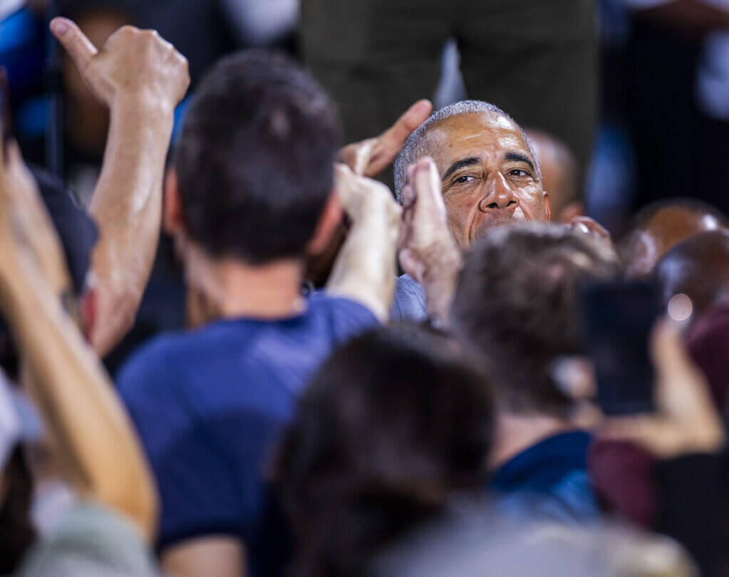 Former President Barack Obama greets members of the crowd after speaking on behalf of the Harri ...