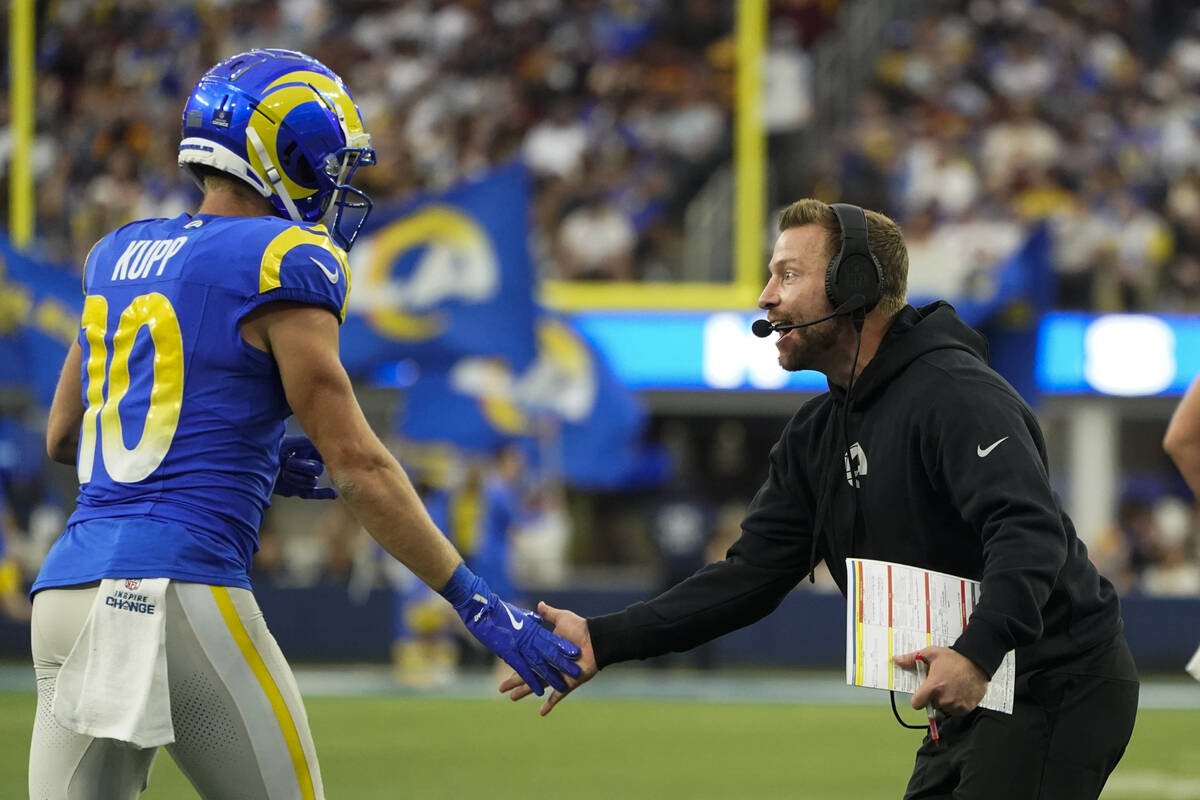 Los Angeles Rams wide receiver Cooper Kupp (10) celebrates a touchdown with head coach Sean McV ...