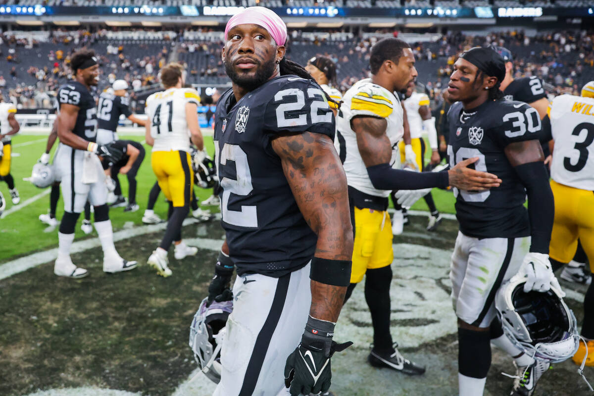 Raiders running back Alexander Mattison (22) walks off the field following an NFL football game ...