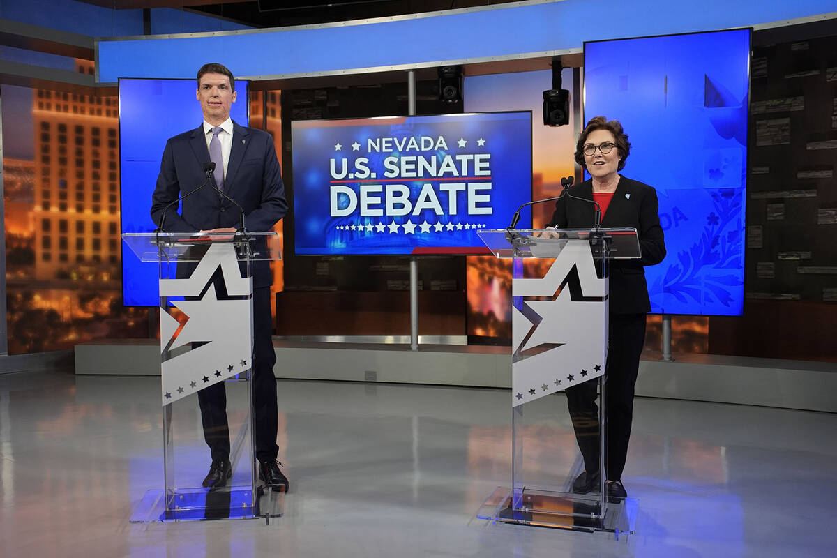 Republican Senate candidate Sam Brown, left, and Sen. Jacky Rosen, D-Nev., stand before a debat ...